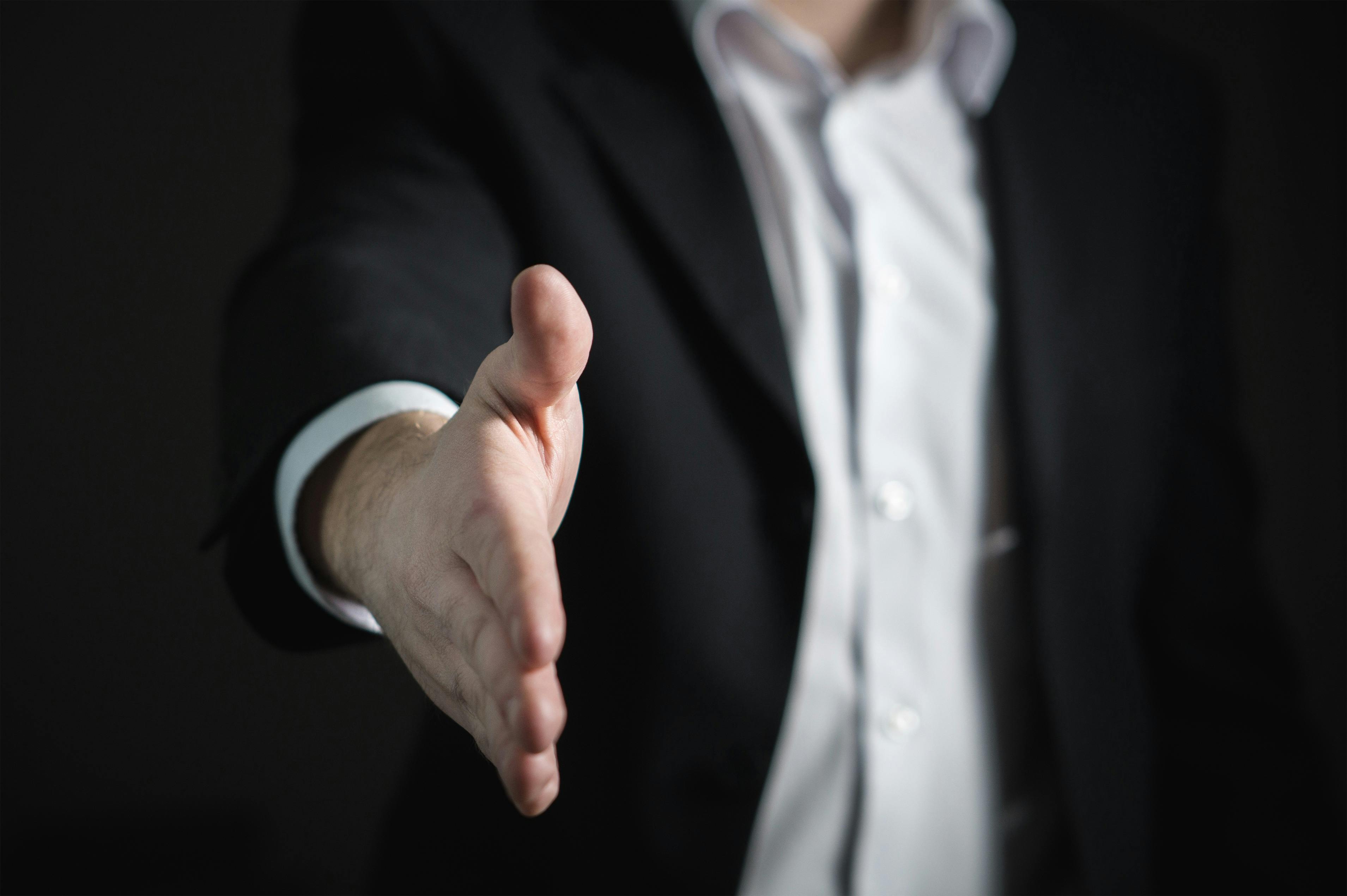 Professional handshake representing trust and partnership in business relationships at Credence Global